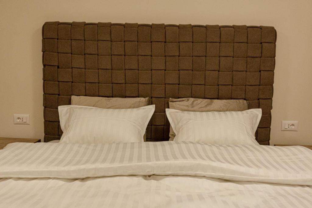Postel nebo postele na pokoji v ubytování Perla Lux apartmani