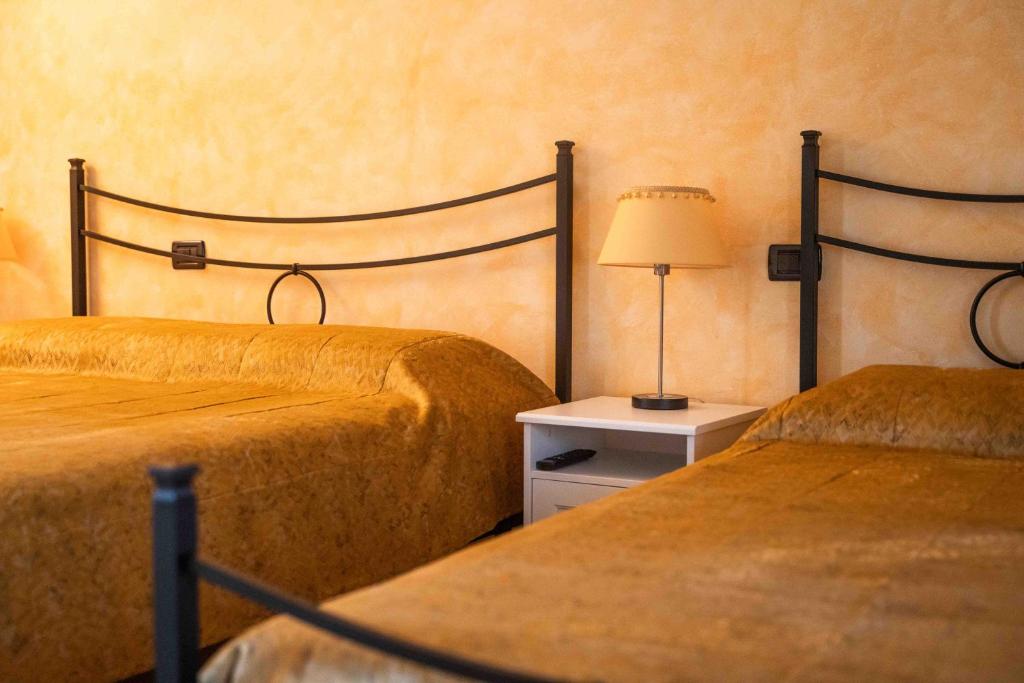 Postel nebo postele na pokoji v ubytování Agriturismo Rihane
