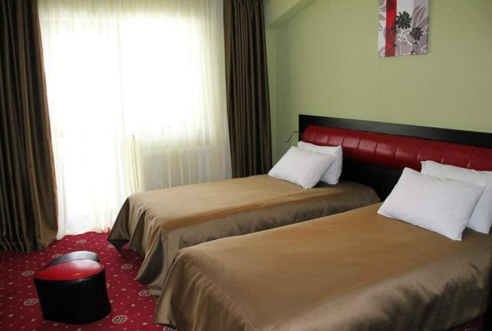 Postel nebo postele na pokoji v ubytování Hotel Villa Palace