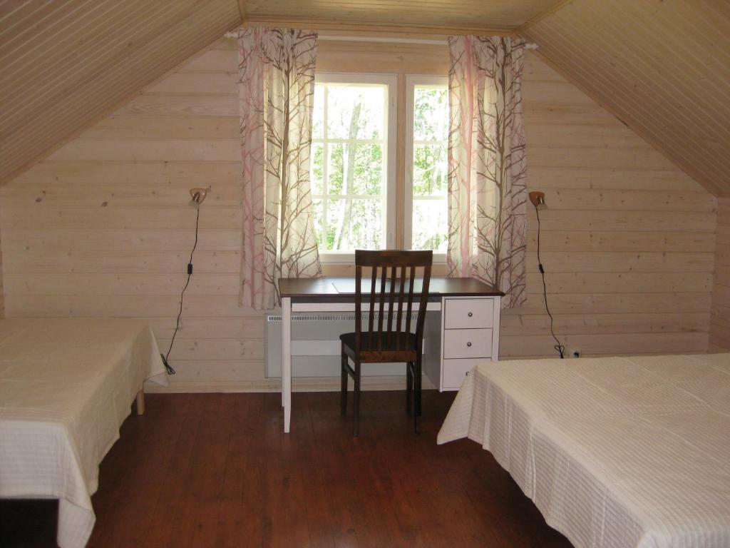 Llit o llits en una habitació de Villa Aurinkoranta