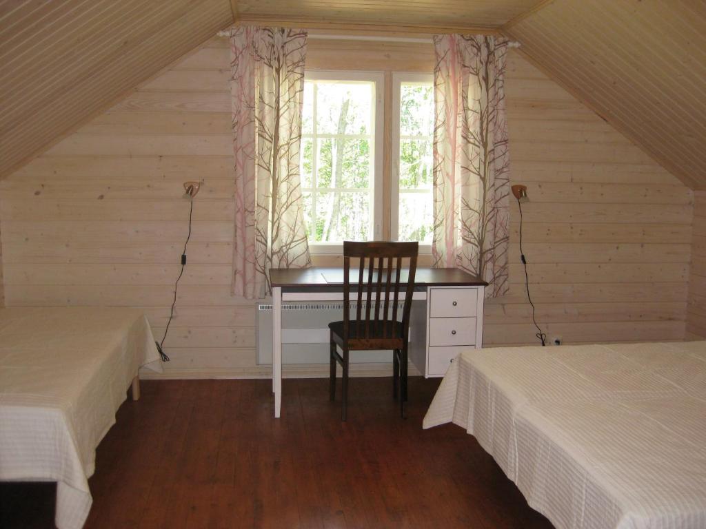 Postel nebo postele na pokoji v ubytování Villa Aurinkoranta