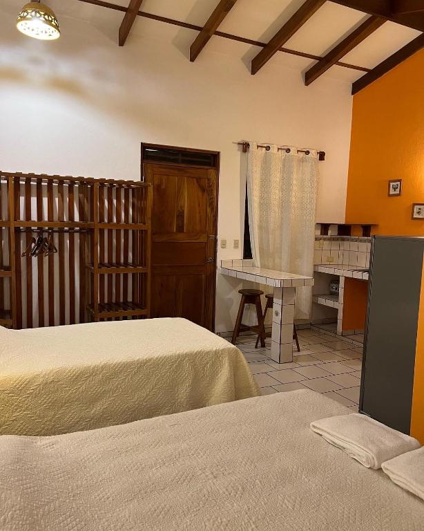 Postel nebo postele na pokoji v ubytování Cabinas El Colibri