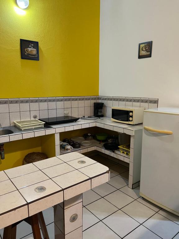 Kuchyň nebo kuchyňský kout v ubytování Cabinas El Colibri