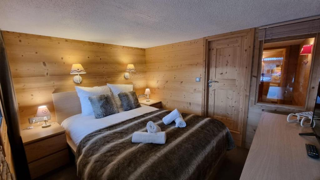 Postel nebo postele na pokoji v ubytování So cosy Val Thorens