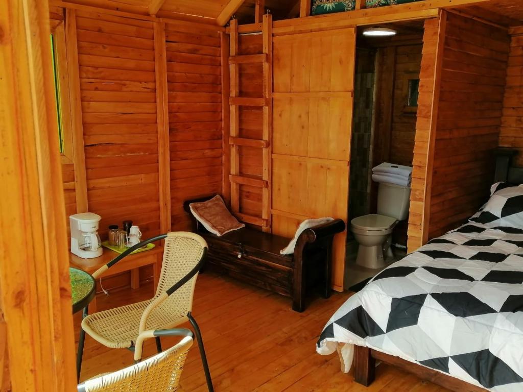 Postel nebo postele na pokoji v ubytování Cabañas Guatavita
