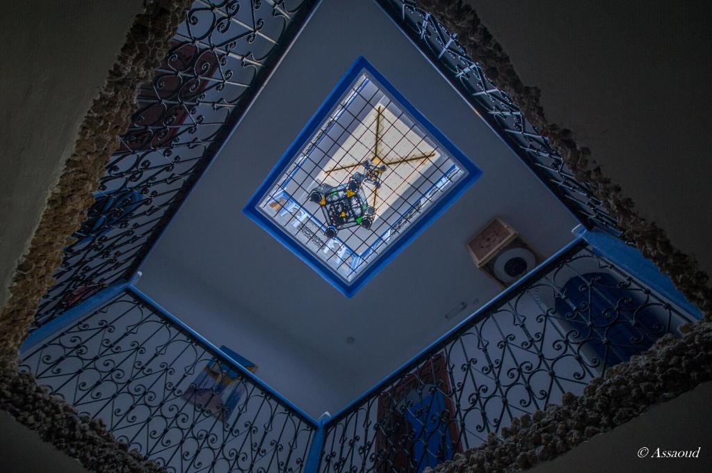 an overhead view of a window on a staircase at Dar El Fanne in Chefchaouen