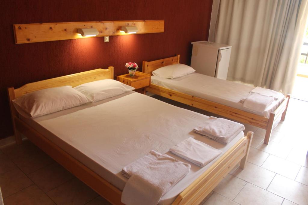 Postel nebo postele na pokoji v ubytování Le Mirage Hotel
