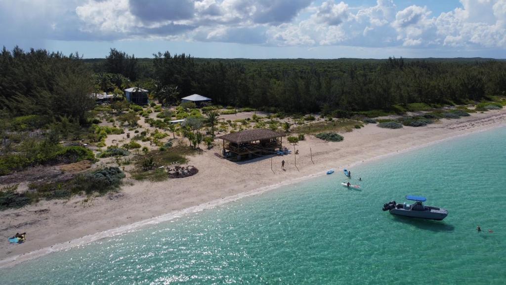 an aerial view of a beach with a boat in the water at Andros Beach Club in Kemps Bay
