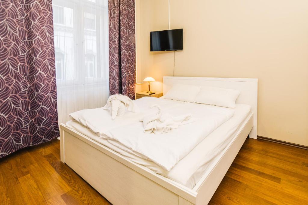 Posteľ alebo postele v izbe v ubytovaní Downtown Core Apartments