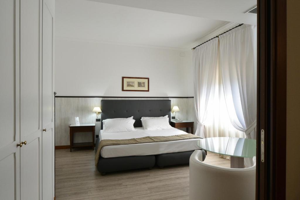 Postel nebo postele na pokoji v ubytování Hotel Della Valle