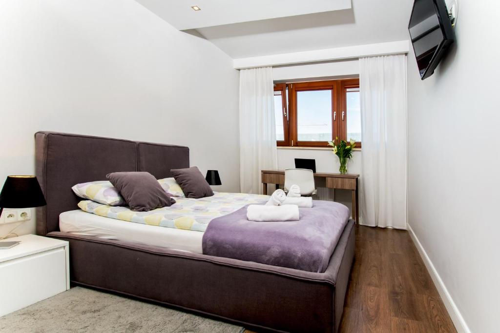 Posteľ alebo postele v izbe v ubytovaní erApartments Oxygen Residence