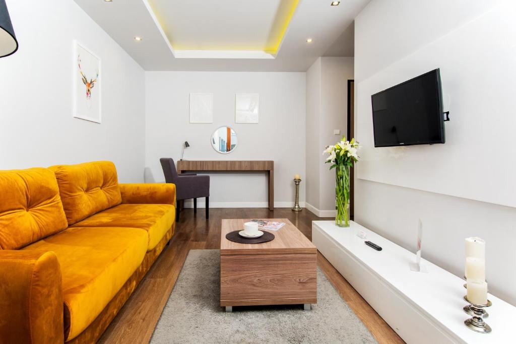 Televízia a/alebo spoločenská miestnosť v ubytovaní erApartments Oxygen Residence