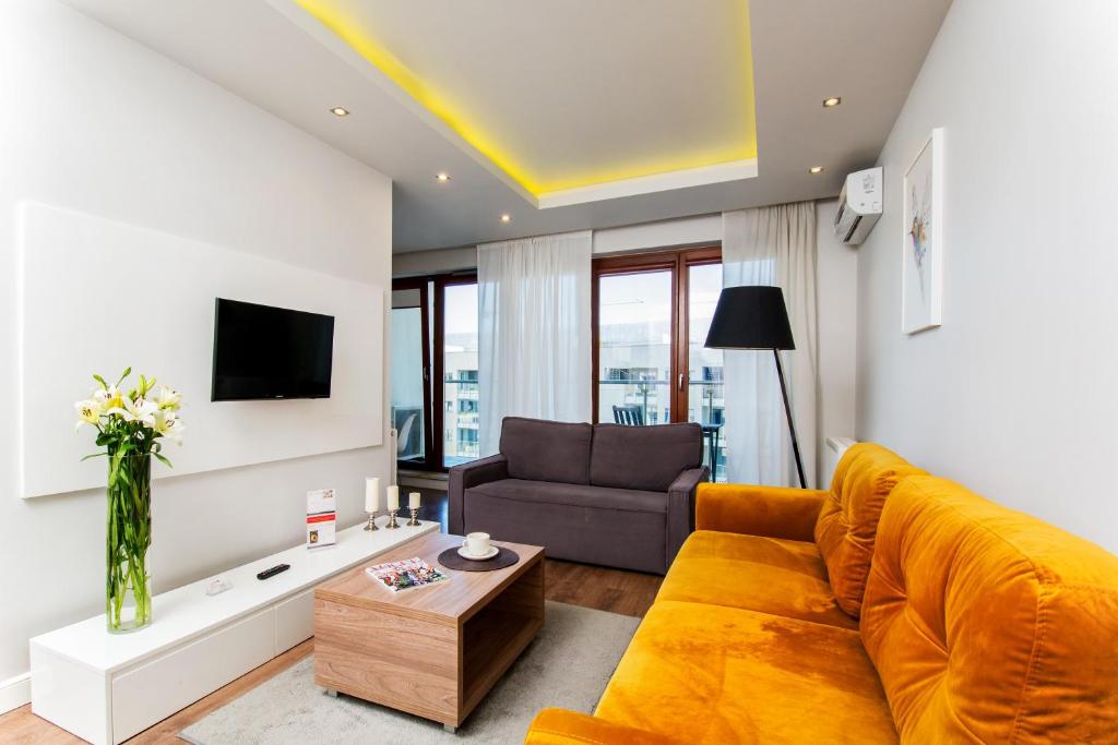 Televízia a/alebo spoločenská miestnosť v ubytovaní erApartments Oxygen Residence