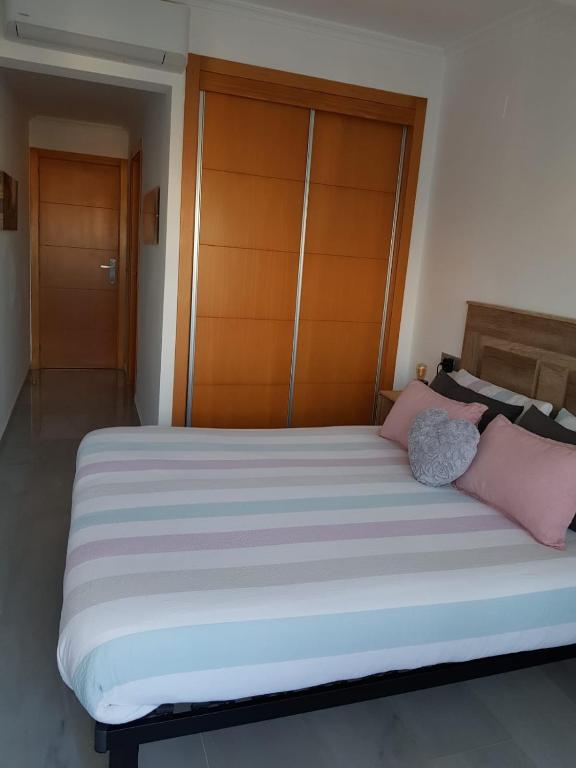 Postel nebo postele na pokoji v ubytování HR PARADISE CALA DE LA VILA JOIOSA