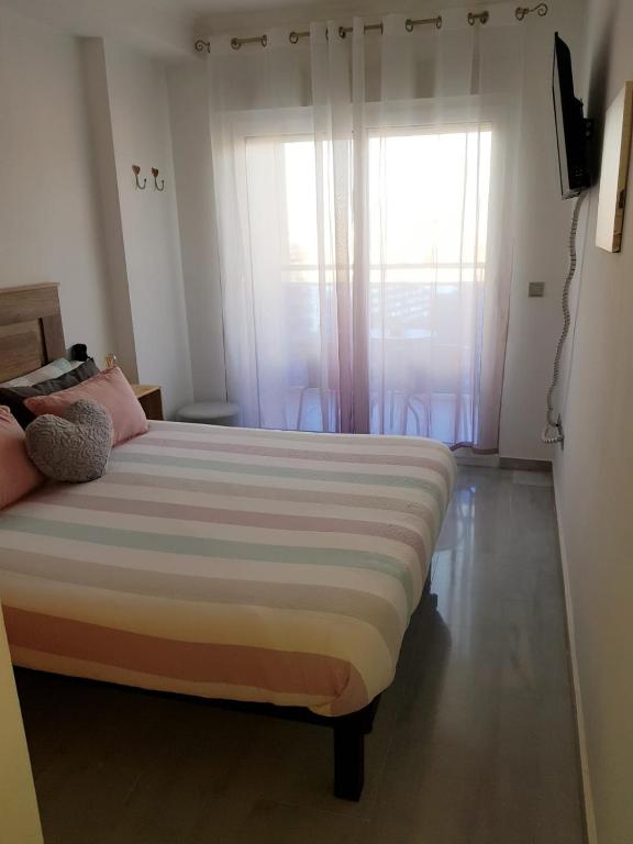 Postel nebo postele na pokoji v ubytování HR PARADISE CALA DE LA VILA JOIOSA