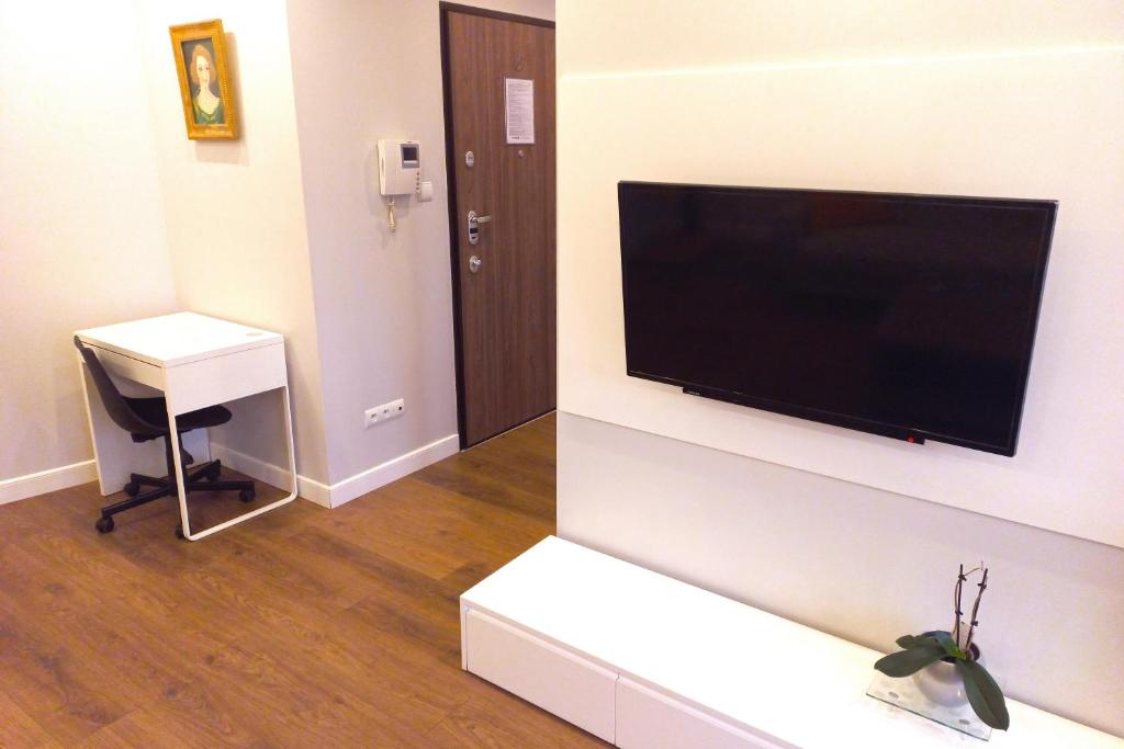 Televízia a/alebo spoločenská miestnosť v ubytovaní erApartments Oxygen Residence