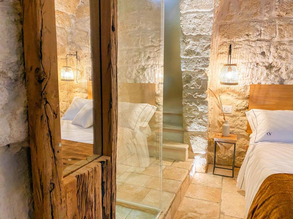 Postel nebo postele na pokoji v ubytování PALAZZO CAVÌ