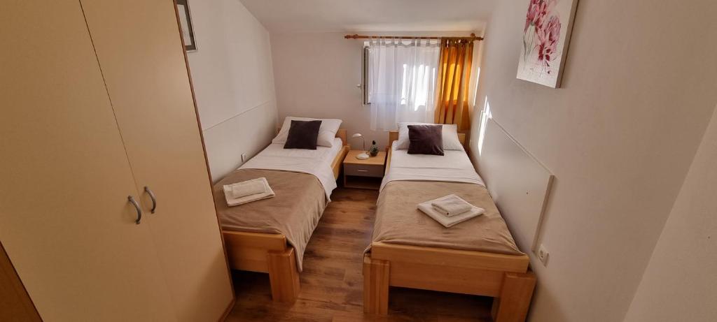 Posteľ alebo postele v izbe v ubytovaní Apartments Ćosic
