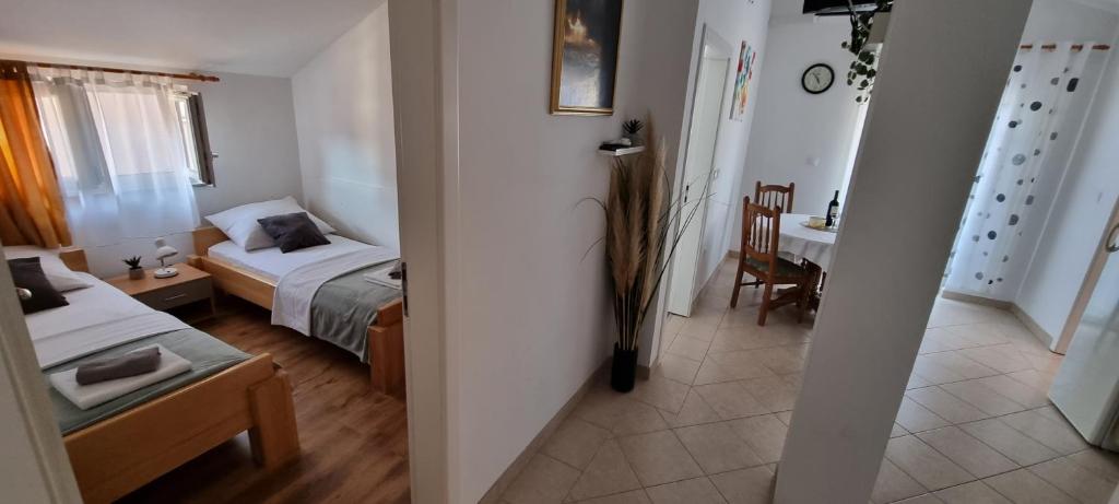 Posteľ alebo postele v izbe v ubytovaní Apartments Ćosic