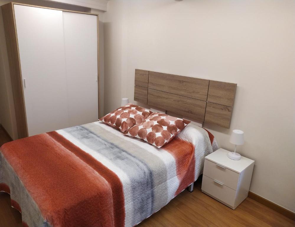 Posteľ alebo postele v izbe v ubytovaní Precioso apartamento acogedor en el centro de Vigo
