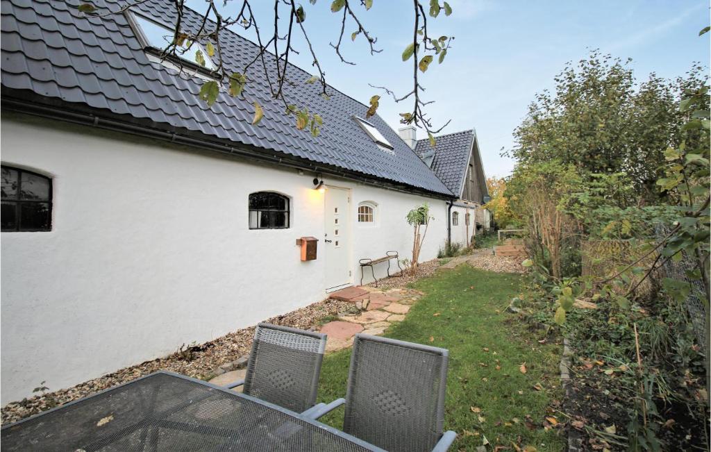 a view of a house with a table and chairs at Gorgeous Home In Rydebäck With Wifi in Rydebäck