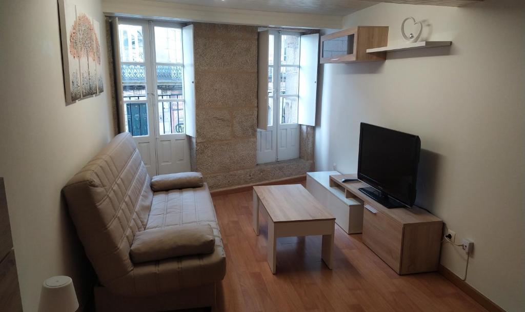 Televízia a/alebo spoločenská miestnosť v ubytovaní Precioso apartamento acogedor en el centro de Vigo