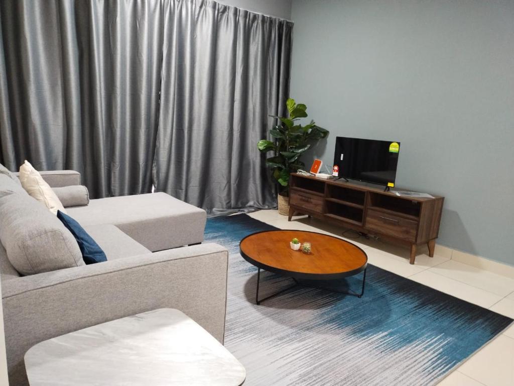 a living room with a couch and a coffee table at 2 bedrooms with balcony@ saville cheras in Cheras