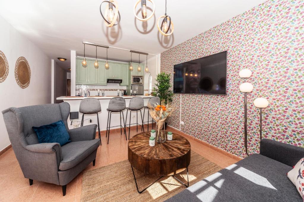 a living room with a couch and a table at Luxury Beach Tanza in Playa Honda