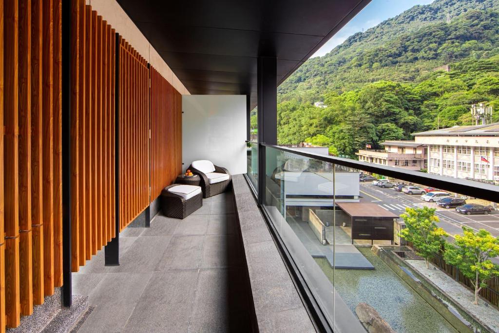 a balcony of a building with a view of a street at Wulai Pause Landis Resort in Wulai
