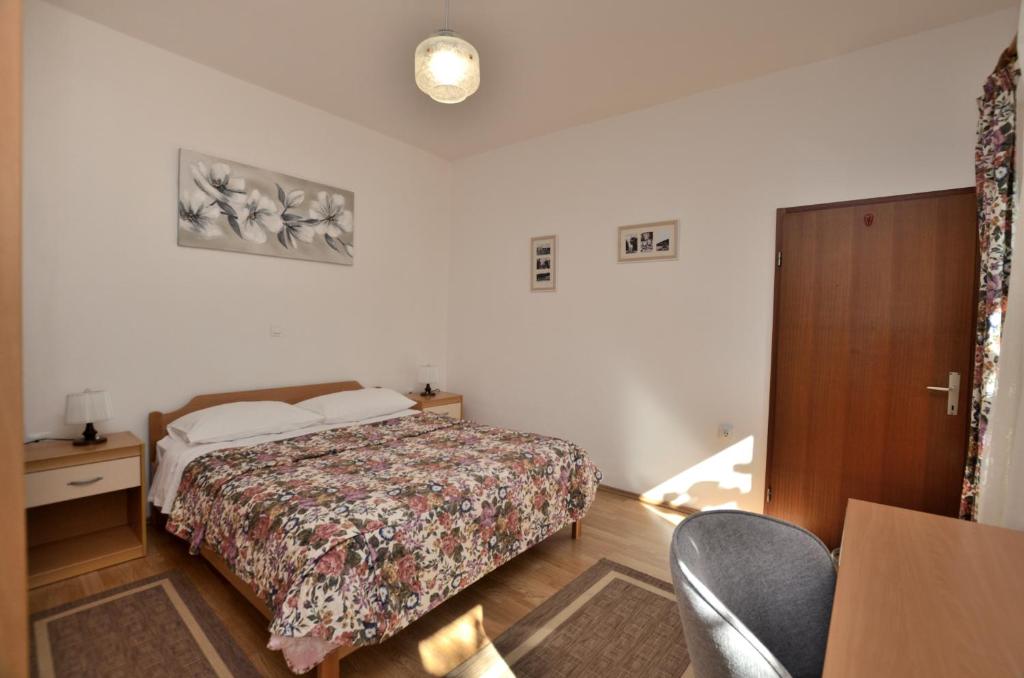 Posteľ alebo postele v izbe v ubytovaní Apartment Gianfranko
