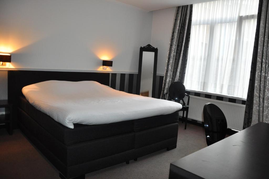 Postel nebo postele na pokoji v ubytování Hotel Louisa