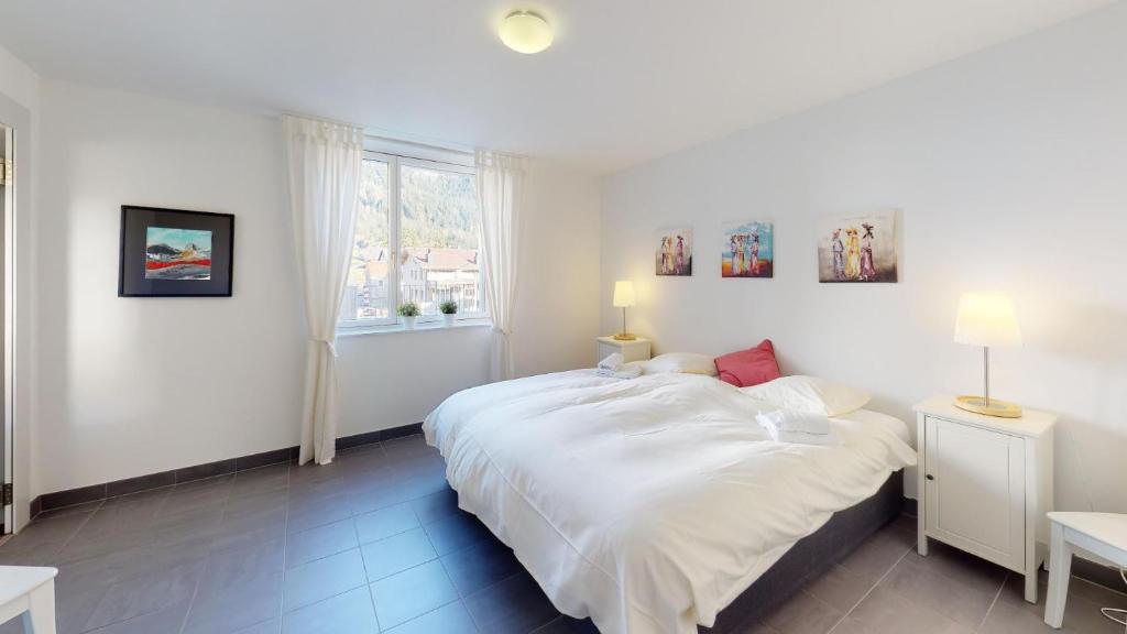 Postel nebo postele na pokoji v ubytování Family Apartment Sot Lantsch-Lenzerheide for 6 persons