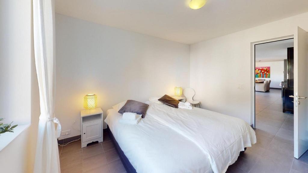 Postel nebo postele na pokoji v ubytování Family Apartment Sot Lantsch-Lenzerheide for 6 persons