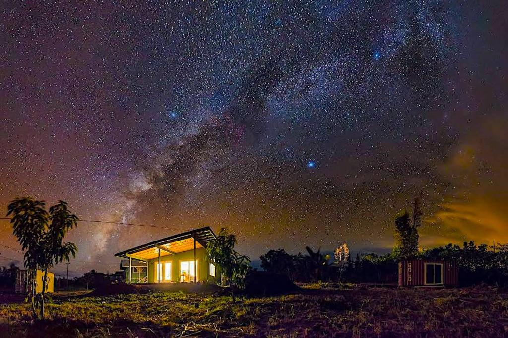 a house under a starry sky at night at Puna Pod in Pahoa