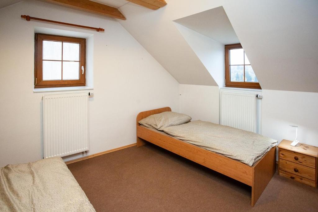 Postel nebo postele na pokoji v ubytování Apartmány NaVyhlídce