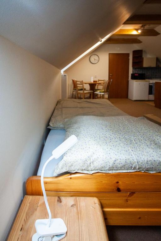 Postel nebo postele na pokoji v ubytování Apartmány NaVyhlídce