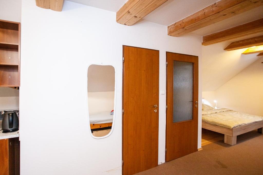 Postel nebo postele na pokoji v ubytování Apartmány NaVyhlídce