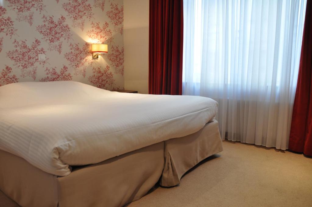 Postel nebo postele na pokoji v ubytování Hotel Louisa