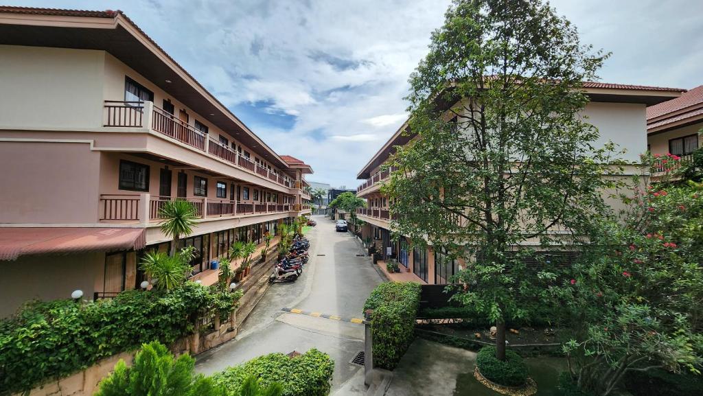a view of a street between two buildings at Panupong Hotel in Chaweng