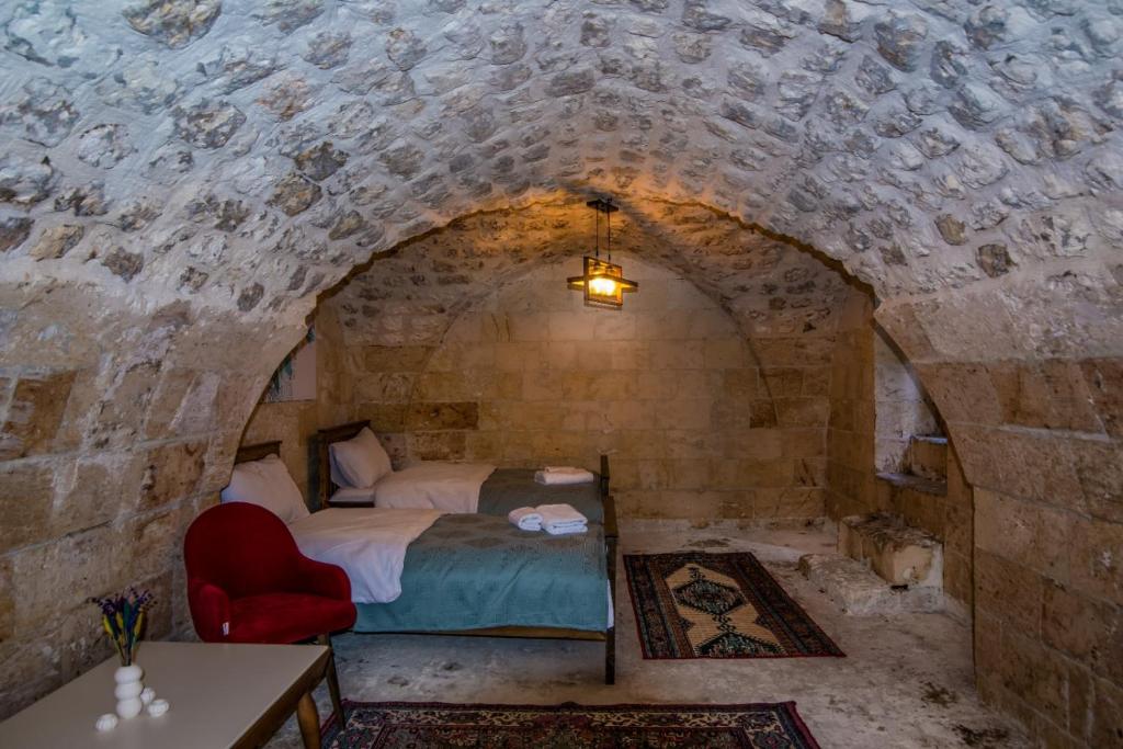 Postel nebo postele na pokoji v ubytování Sarmaşık Otel