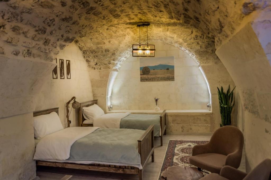 Postel nebo postele na pokoji v ubytování Sarmaşık Otel