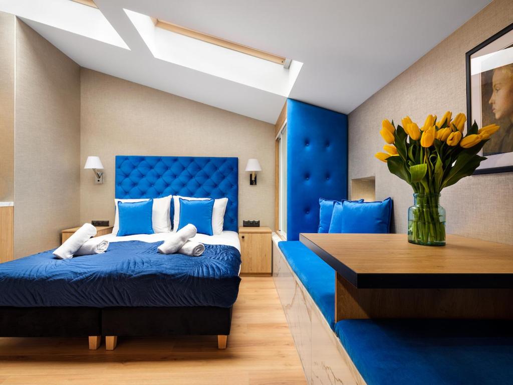 Posteľ alebo postele v izbe v ubytovaní Tyzenhauz Apartments Comfort