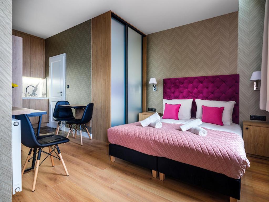 Posteľ alebo postele v izbe v ubytovaní Tyzenhauz Apartments Comfort