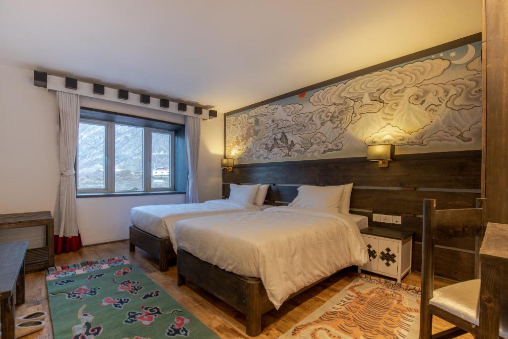 Postel nebo postele na pokoji v ubytování Lo Mustang Himalayan Resort