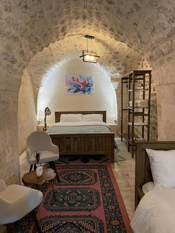 Postel nebo postele na pokoji v ubytování Sarmaşık Otel
