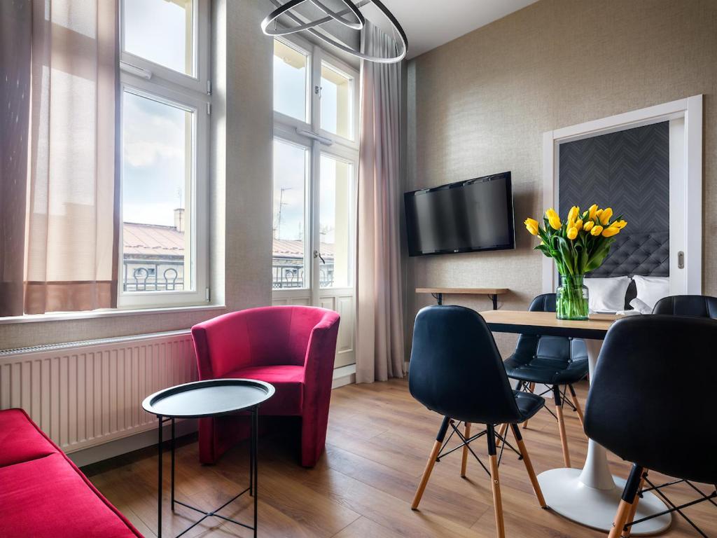 Televízia a/alebo spoločenská miestnosť v ubytovaní Tyzenhauz Apartments Comfort