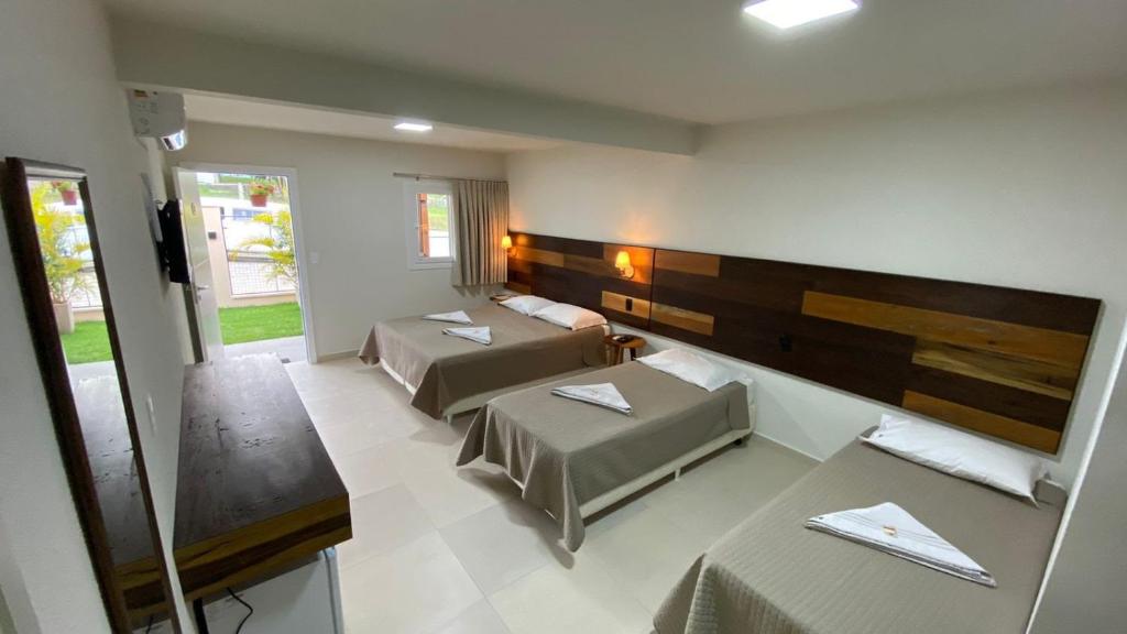 Katil atau katil-katil dalam bilik di Pousada Quatro Estações