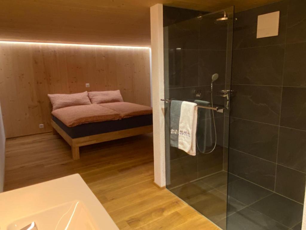 Postel nebo postele na pokoji v ubytování Chalet Brünig