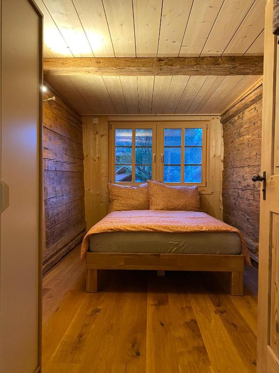 Postel nebo postele na pokoji v ubytování Chalet Brünig