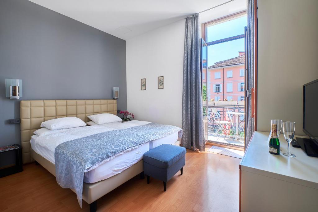 Postel nebo postele na pokoji v ubytování Hotel Zurigo Downtown